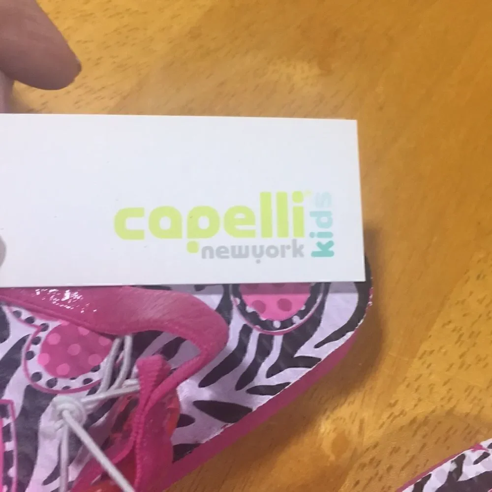Capelli pink white black zebra 8-9 flip flops.  NWT.   Hearts zebra patterned